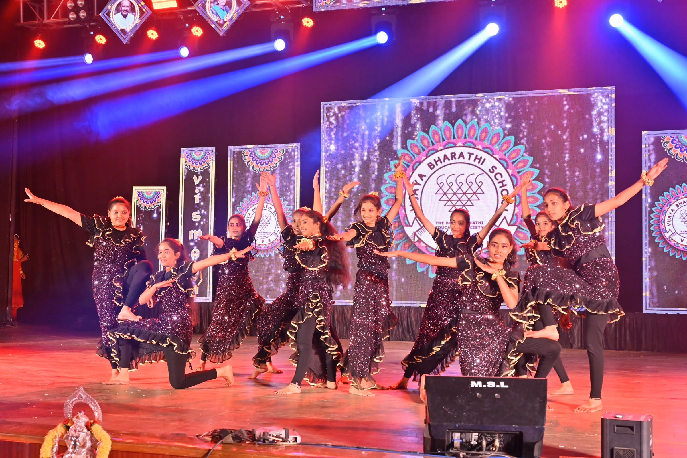 Students performing on stage at the Annual Day