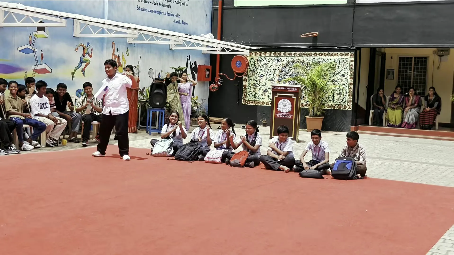 Staff and students in the courtyard on Teachers' Day