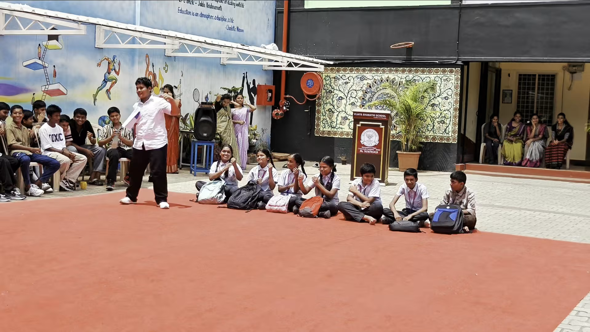 Students and staff in the school courtyard